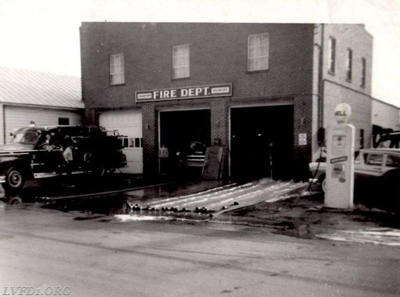 1961: Hose washing time at Fenwick St. station.  Bobby Hammett by engine.
Photo credit: Brian Hammett